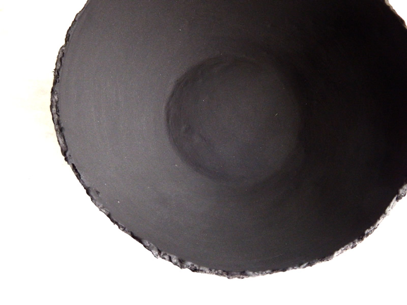 Black papier maché clay bowl with smooth finish coat applied
