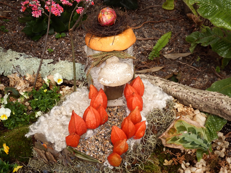 Fairy garden with mushrooms and paper lanterns
