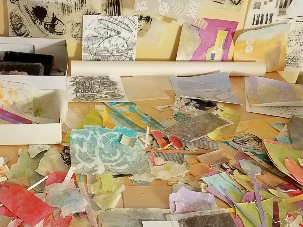 Studio table with collage elements