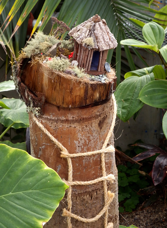 Fairy home made of a log and twigs, moss and bark